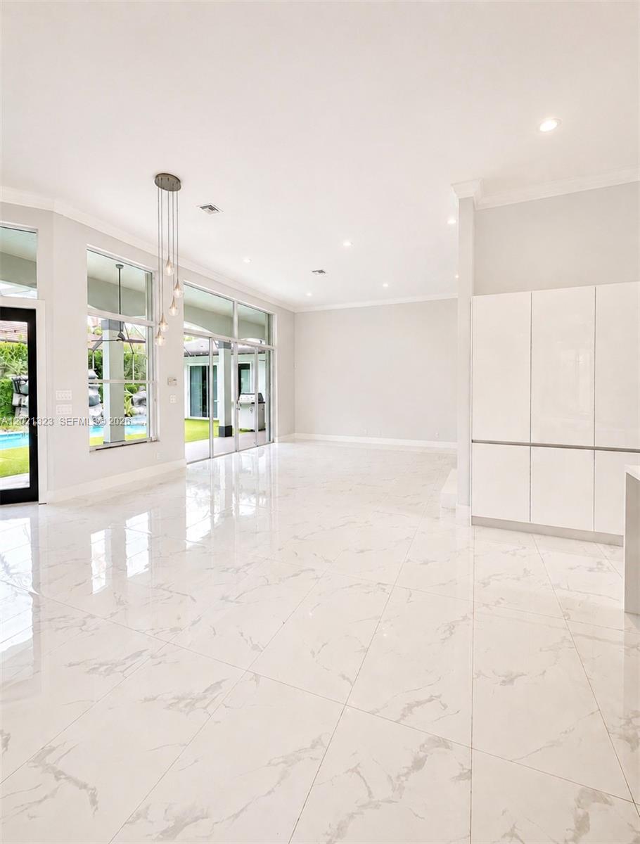 354 Mallard Road, Unit O Weston, FL 33327 - Photo 8 of 29 a view of an empty room with a window