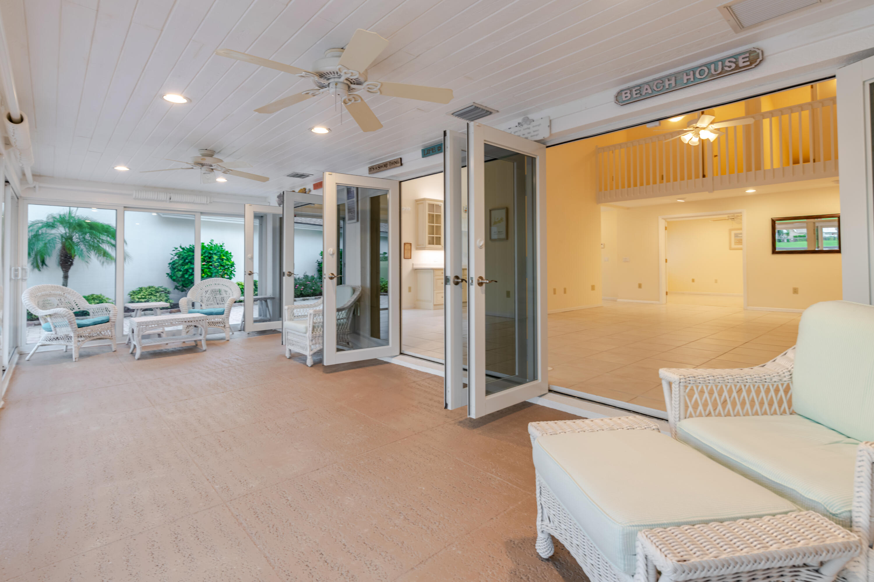 114 Beach Summit Court Jupiter, FL 33477 - Photo 31 of 97 a living room with furniture and a large window