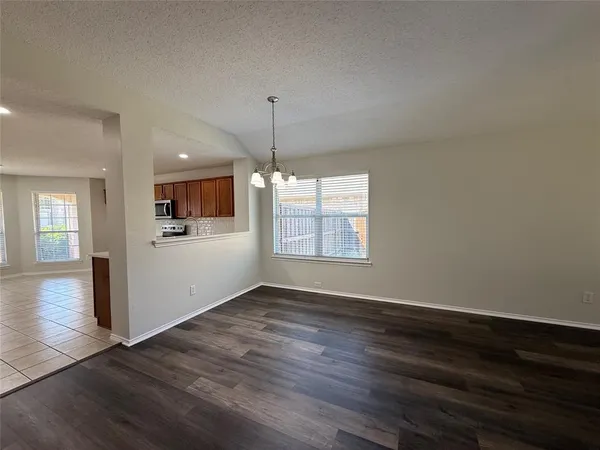 a bedroom with a bed couch and window