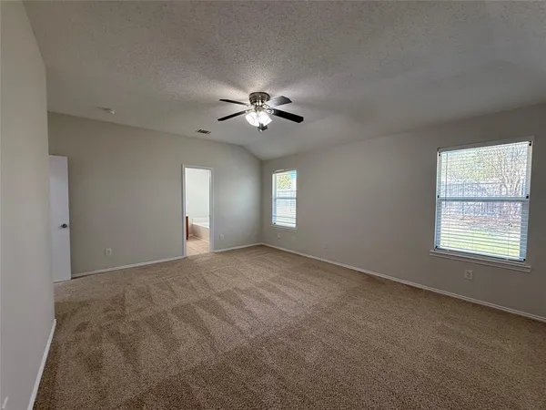 a spacious bathroom with a double vanity sink a large mirror and bathtub