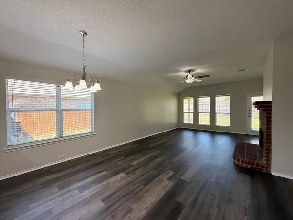 a kitchen with stainless steel appliances a stove a sink a microwave and a refrigerator