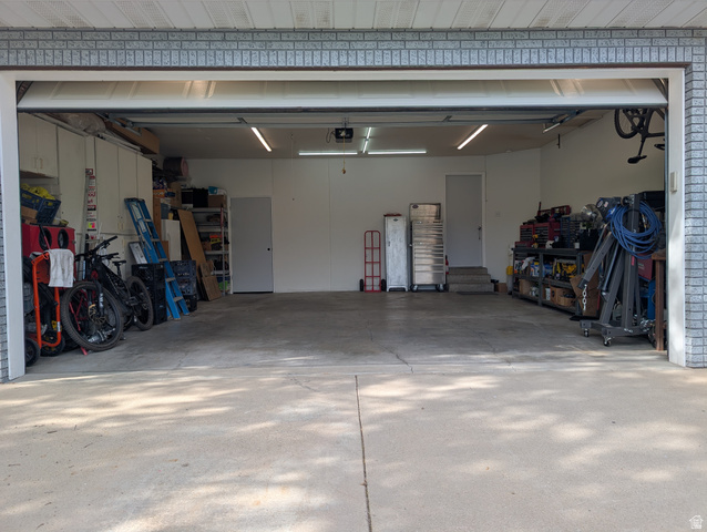 897 East 1200 North Mapleton, UT 84664 - Photo 24 of 54 Oversize garage with an 18 ft garage door, bright lighting, 240 v outlet and a storage room.