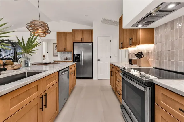 a spacious bathroom with a double vanity sink and a mirror