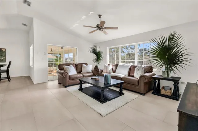 a spacious bedroom with a bed and a large window