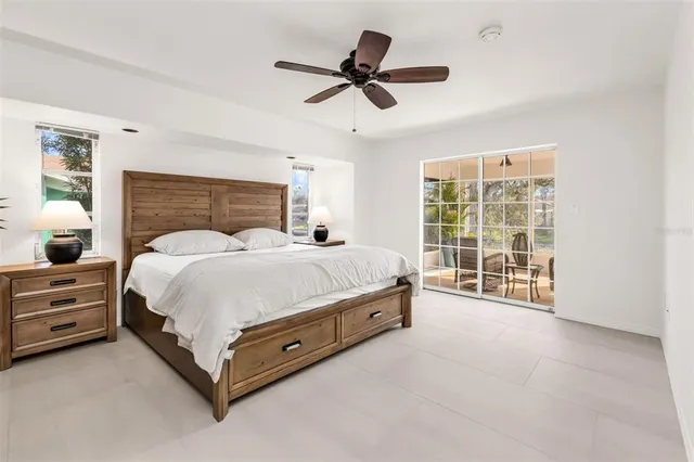 a bed room with bed and a chandelier