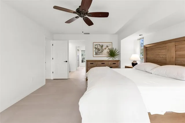 a en suite bathroom with a double vanity sink and a mirror