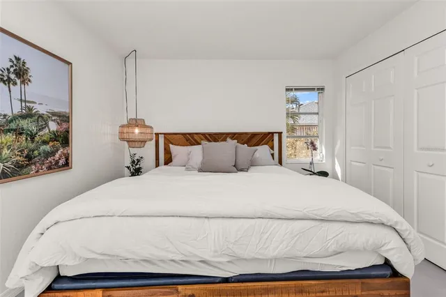 a bathroom with a bathtub a window and a shower
