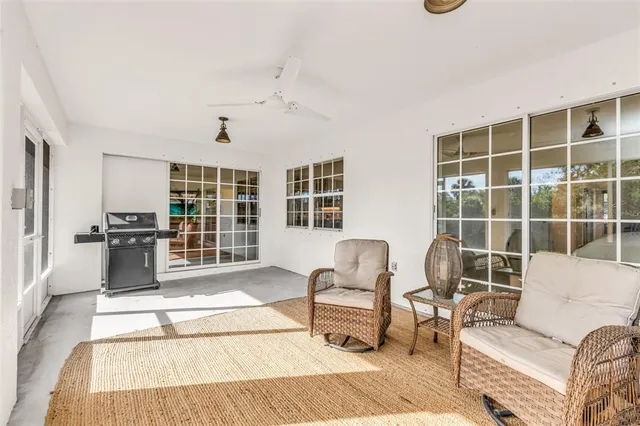 a bathroom with a bathtub and a large window