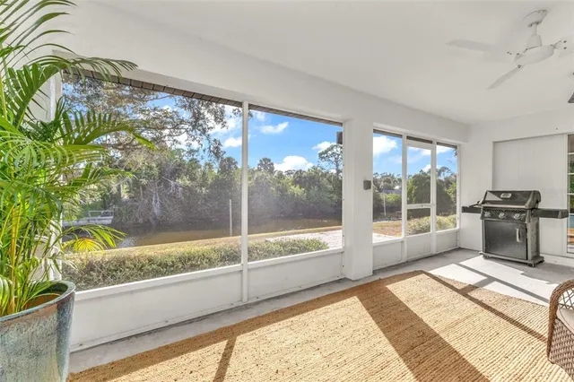 a view of a swimming pool with an outdoor space and seating area