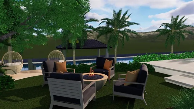 a view of a backyard with sitting area