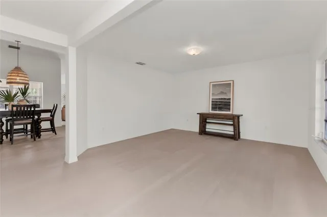 a view of room with window and ceiling fan
