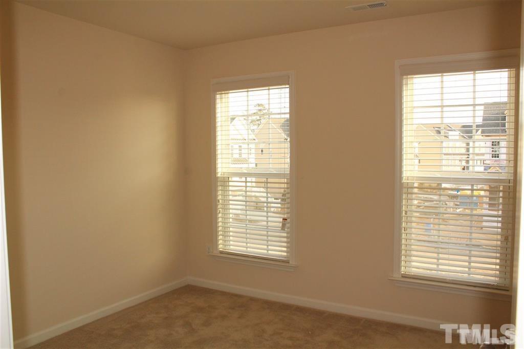 2102 Peakside Drive Apex, NC 27523 - Photo 14 of 21 a view of an empty room with a window