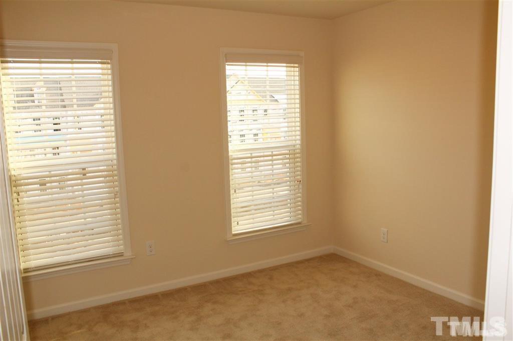 2102 Peakside Drive Apex, NC 27523 - Photo 16 of 21 a view of an empty room with a window