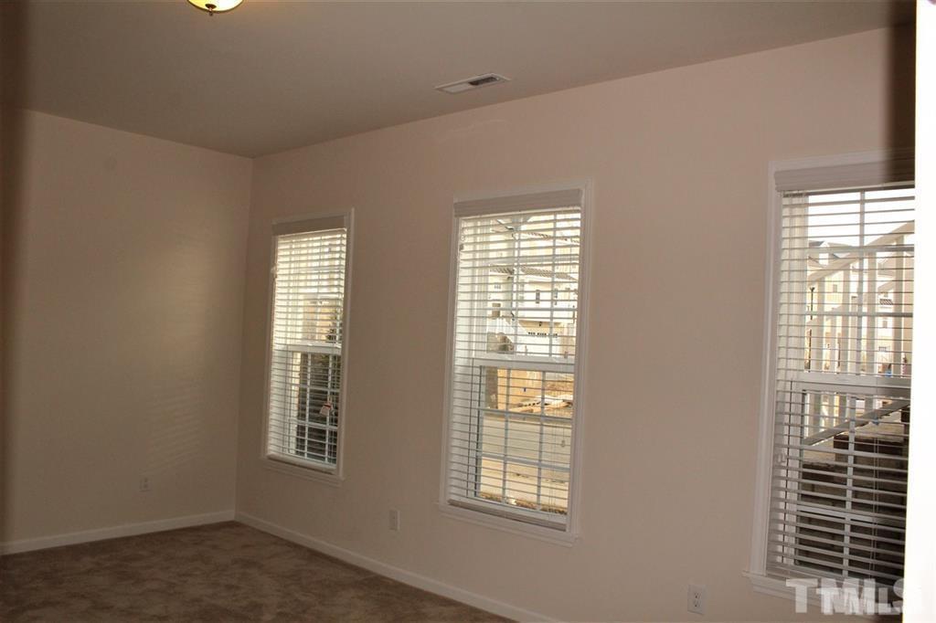 2102 Peakside Drive Apex, NC 27523 - Photo 21 of 21 an empty room with windows