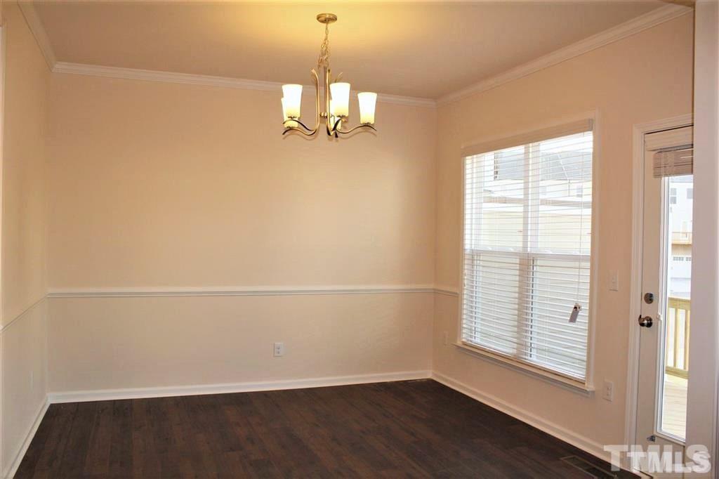2102 Peakside Drive Apex, NC 27523 - Photo 9 of 21 a view of empty room with wooden floor and fan