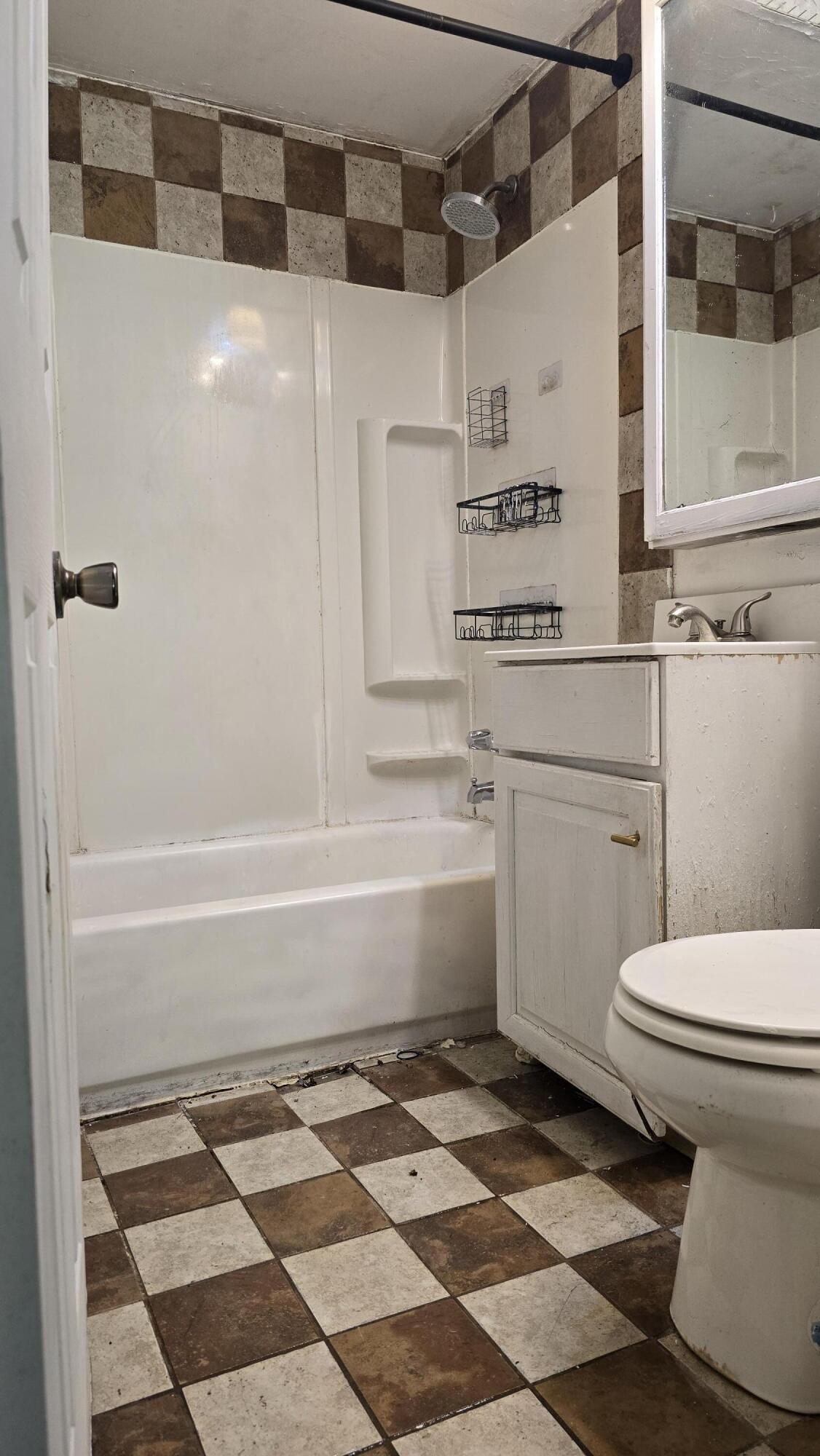 2207 North County Line Road Portage, IN 46368 - Photo 14 of 16 a bathroom with a white toilet and a shower