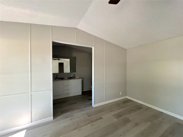 a view of a kitchen cabinets and wooden floor