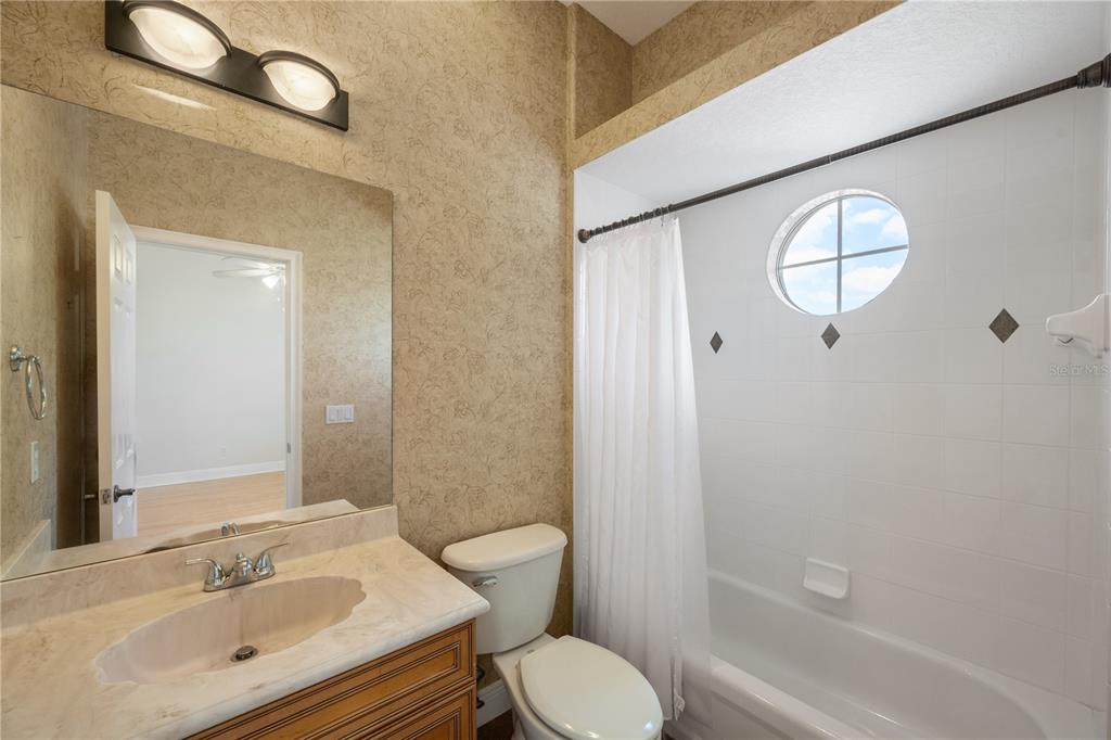 8119 Vía Rosa Orlando, FL 32836 - Photo 28 of 62 a bathroom with a sink toilet and shower