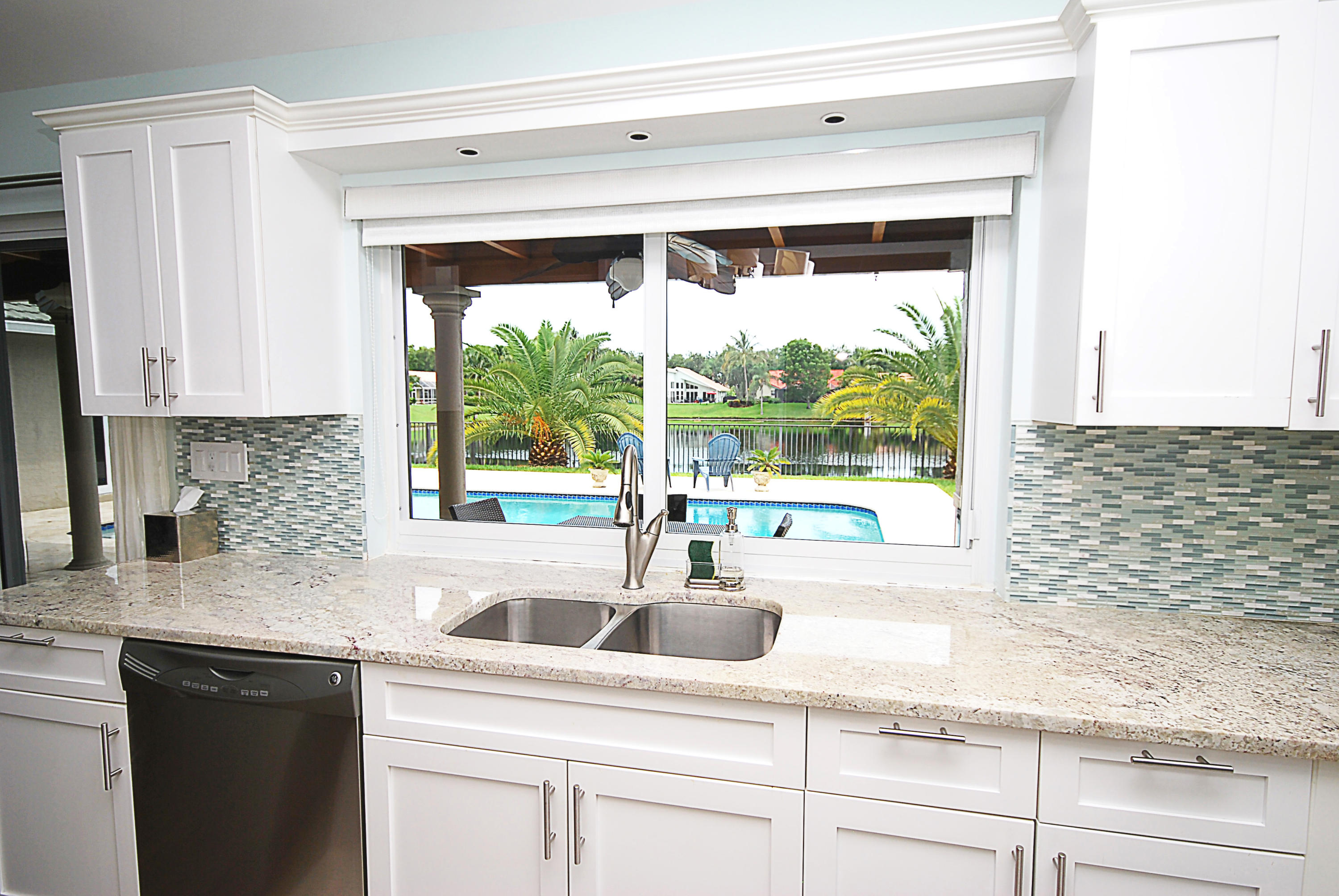 2621 Northwest 39th Street Boca Raton, FL 33434 - Photo 8 of 32 Kitchen sink view of lake and pool