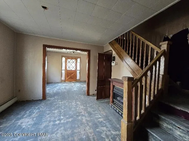 a kitchen with granite countertop wooden floors a sink and wooden cabinets