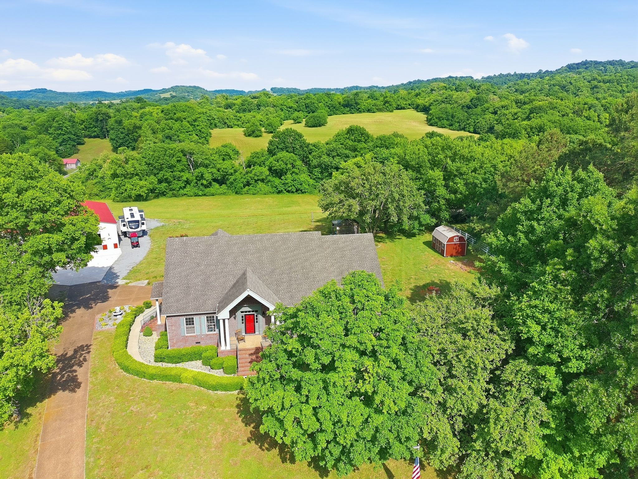 1150 Cochran Cemetery Road Lewisburg, TN 37091 - Photo 48 of 63 an aerial view of a house with a yard basket ball court and outdoor seating