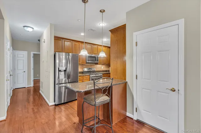 a view of a kitchen and a kitchen