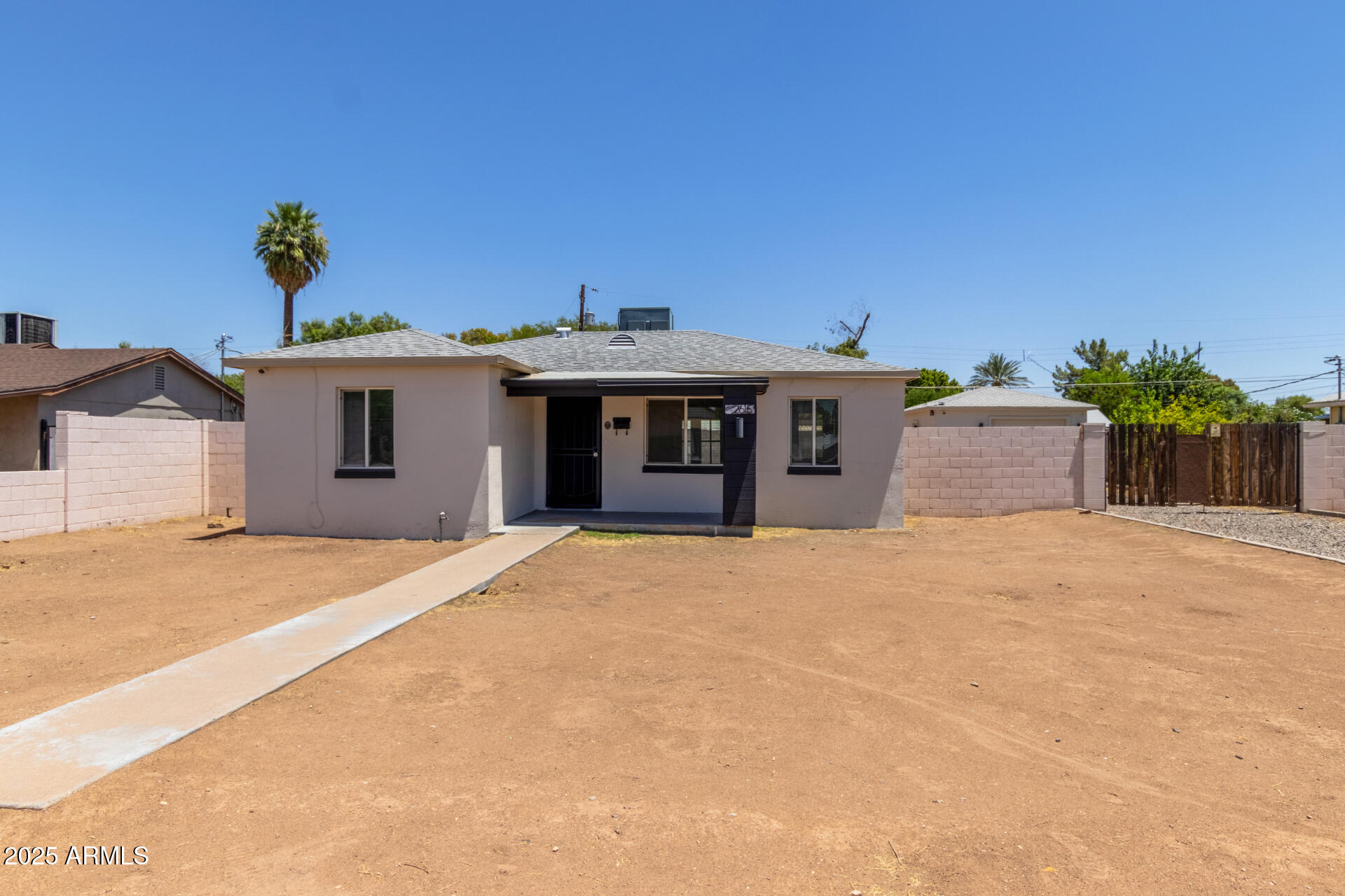 2615 North 29th Place Phoenix, AZ 85008 - Photo 1 of 26 a front view of a house with a yard and garage