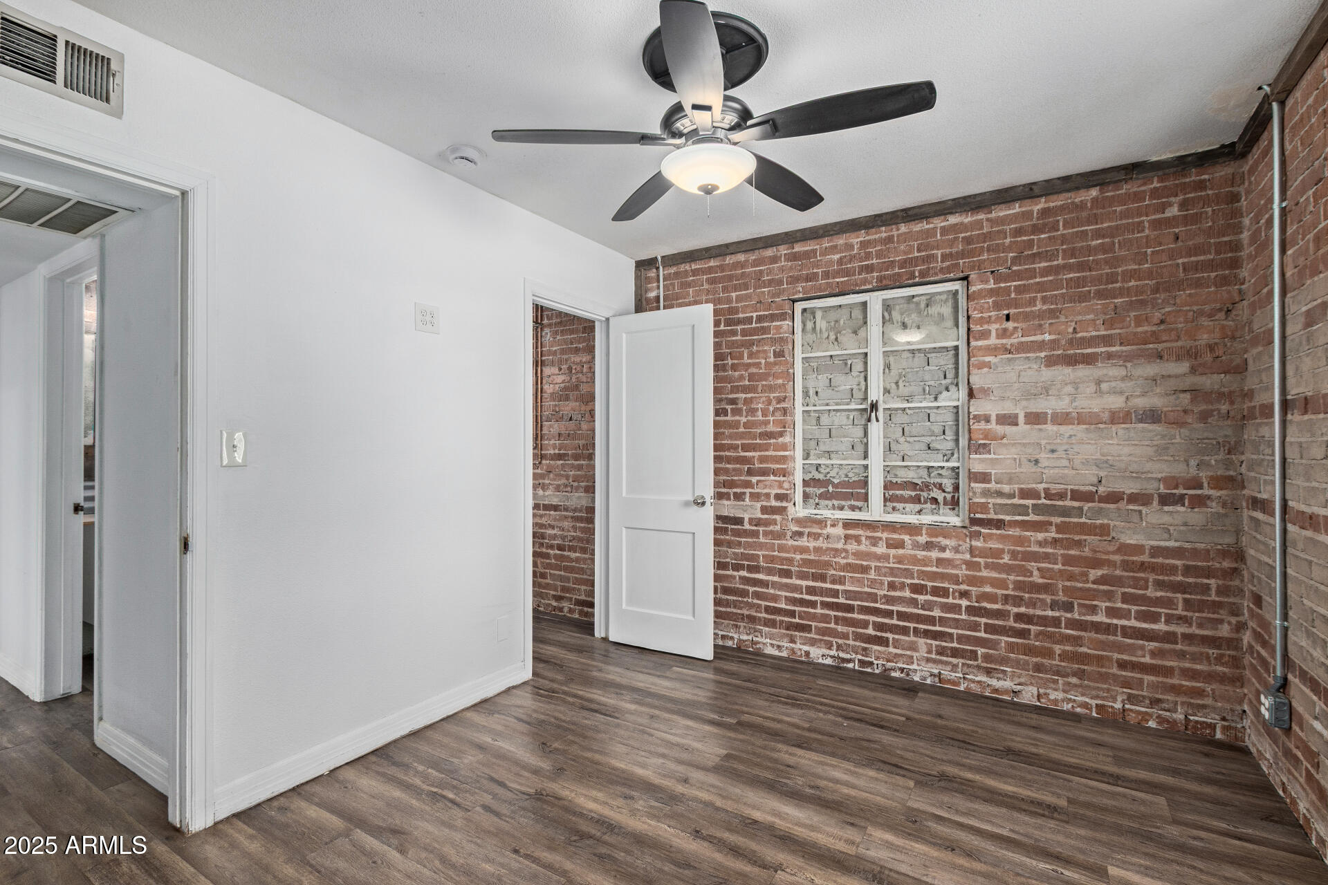 2615 North 29th Place Phoenix, AZ 85008 - Photo 18 of 26 a view of an entryway with wooden floor