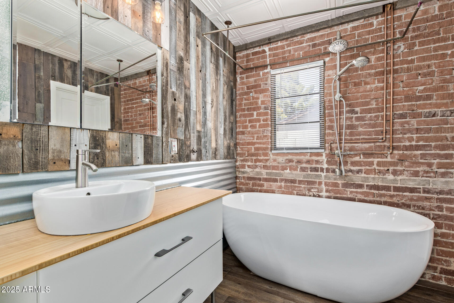 2615 North 29th Place Phoenix, AZ 85008 - Photo 19 of 26 a bathroom with a sink and a bathtub