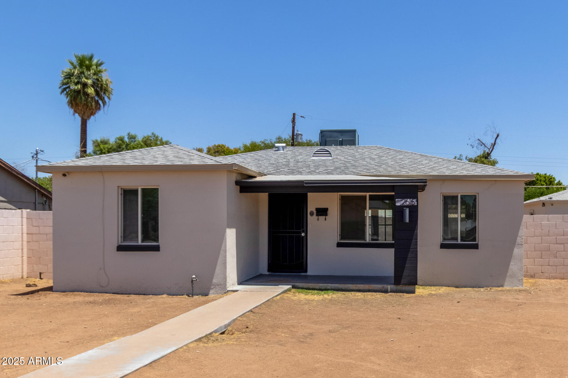 2615 North 29th Place Phoenix, AZ 85008 - Photo 2 of 26 a front view of a house with a garage