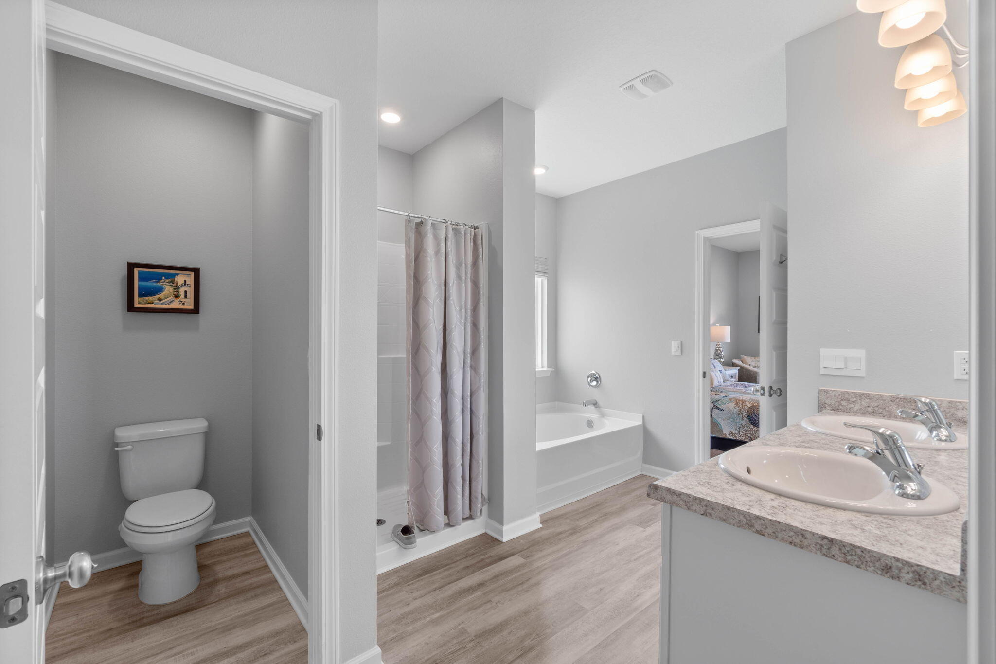 38 Silverthorn Street Freeport, FL 32439 - Photo 20 of 42 a bathroom with a granite countertop sink toilet and shower