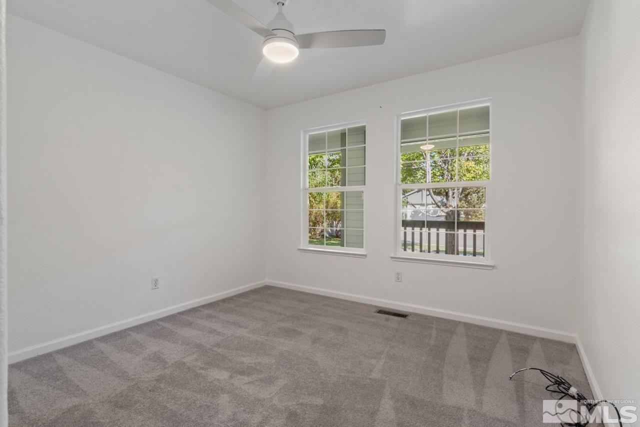 17040 Castle Pine Drive Reno, NV 89511 - Photo 24 of 31 an empty room with a window