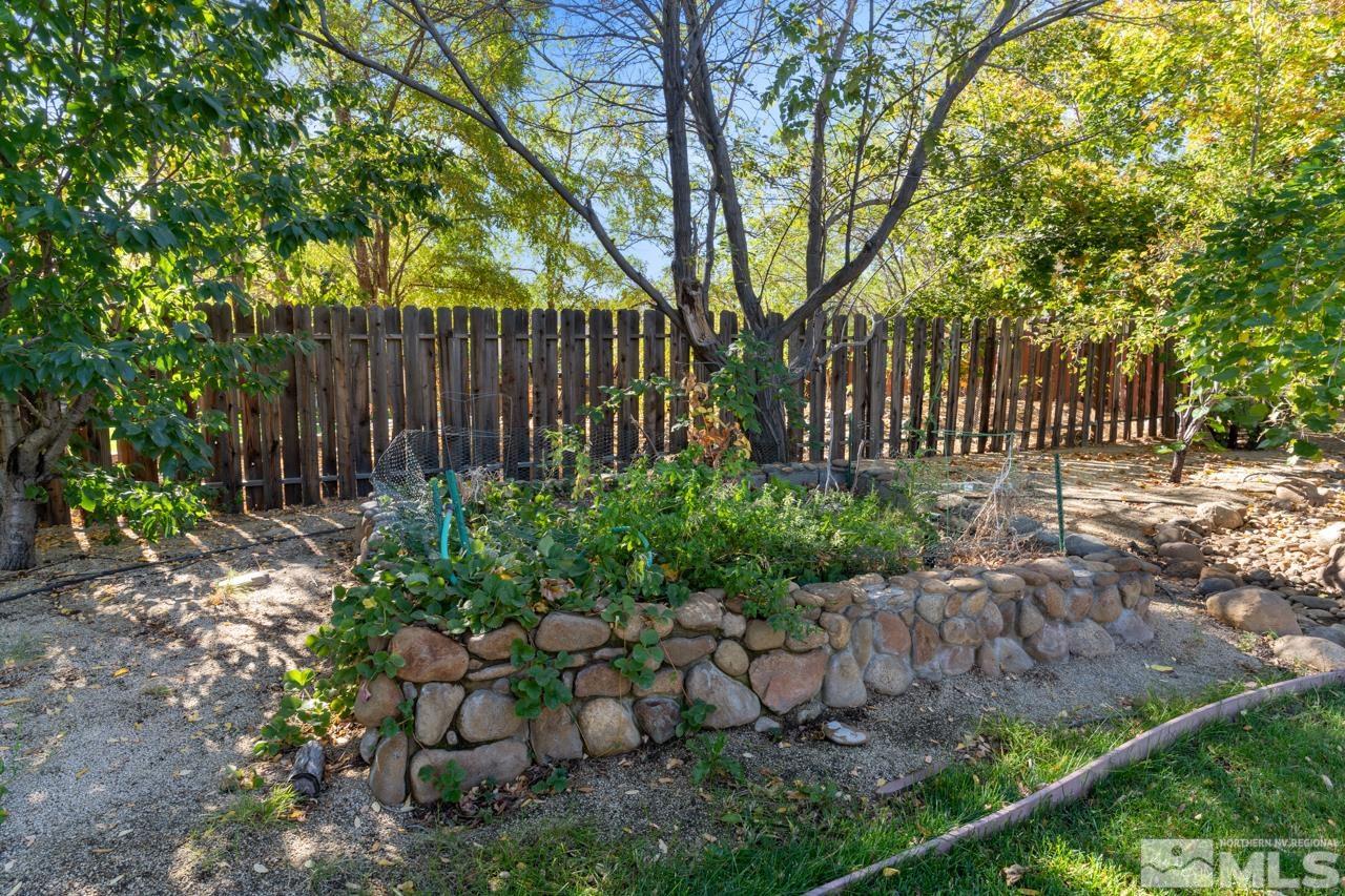 17040 Castle Pine Drive Reno, NV 89511 - Photo 30 of 31 a garden view with iron fence