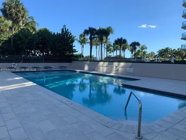 a view of swimming pool with outdoor seating