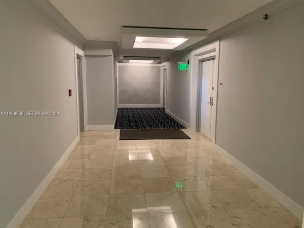 a view of hallway with walk in closet