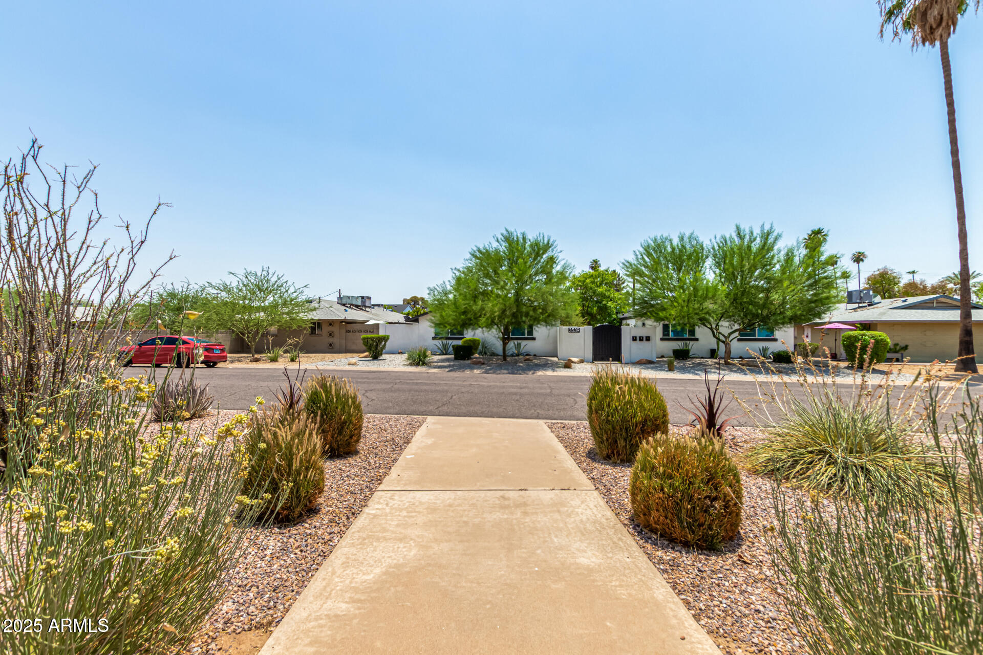 3540 East Montecito Avenue, Unit 1 Phoenix, AZ 85018 - Photo 2 of 26 a view of a swimming pool and lounge chair