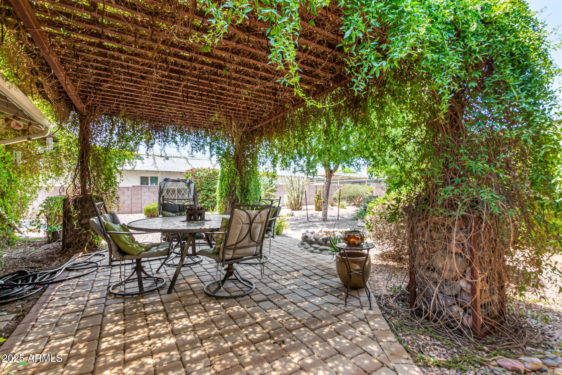 3540 East Montecito Avenue, Unit 1 Phoenix, AZ 85018 - Photo 22 of 26 a view of a chairs and table in the patio
