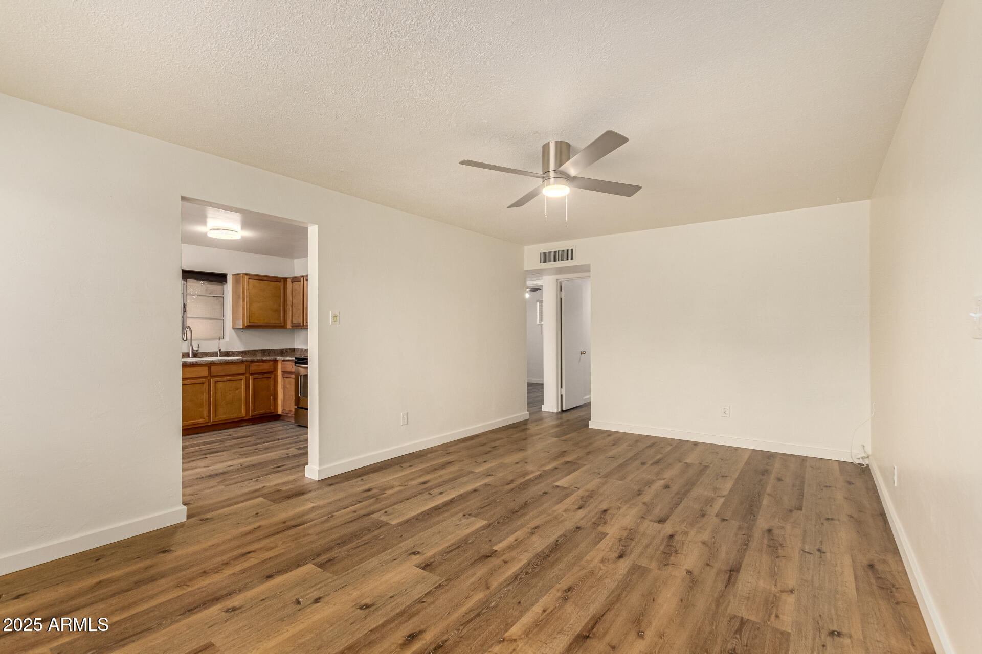 3540 East Montecito Avenue, Unit 1 Phoenix, AZ 85018 - Photo 8 of 26 a view of a kitchen with wooden floor and a sink
