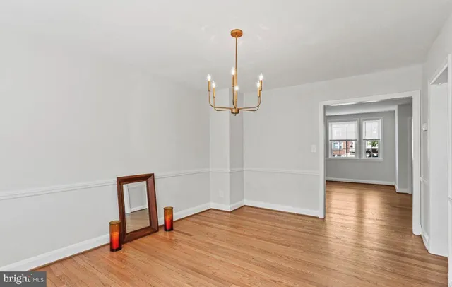 a view of a room with wooden floor and staircase