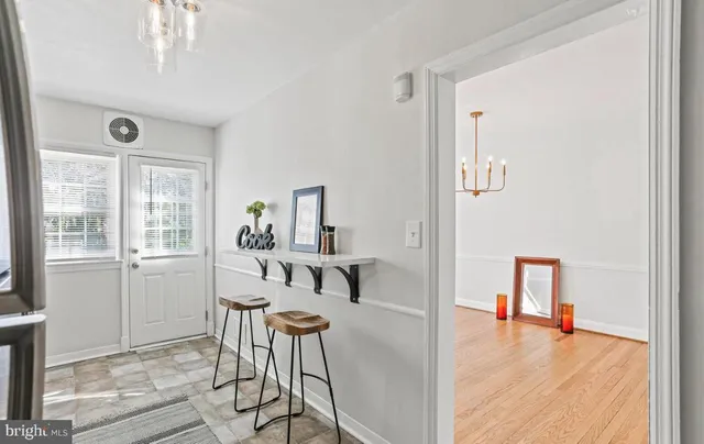 a view of a livingroom with a table and workspace