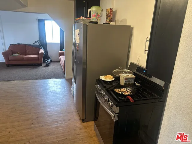 a kitchen with a sink and a stove top oven