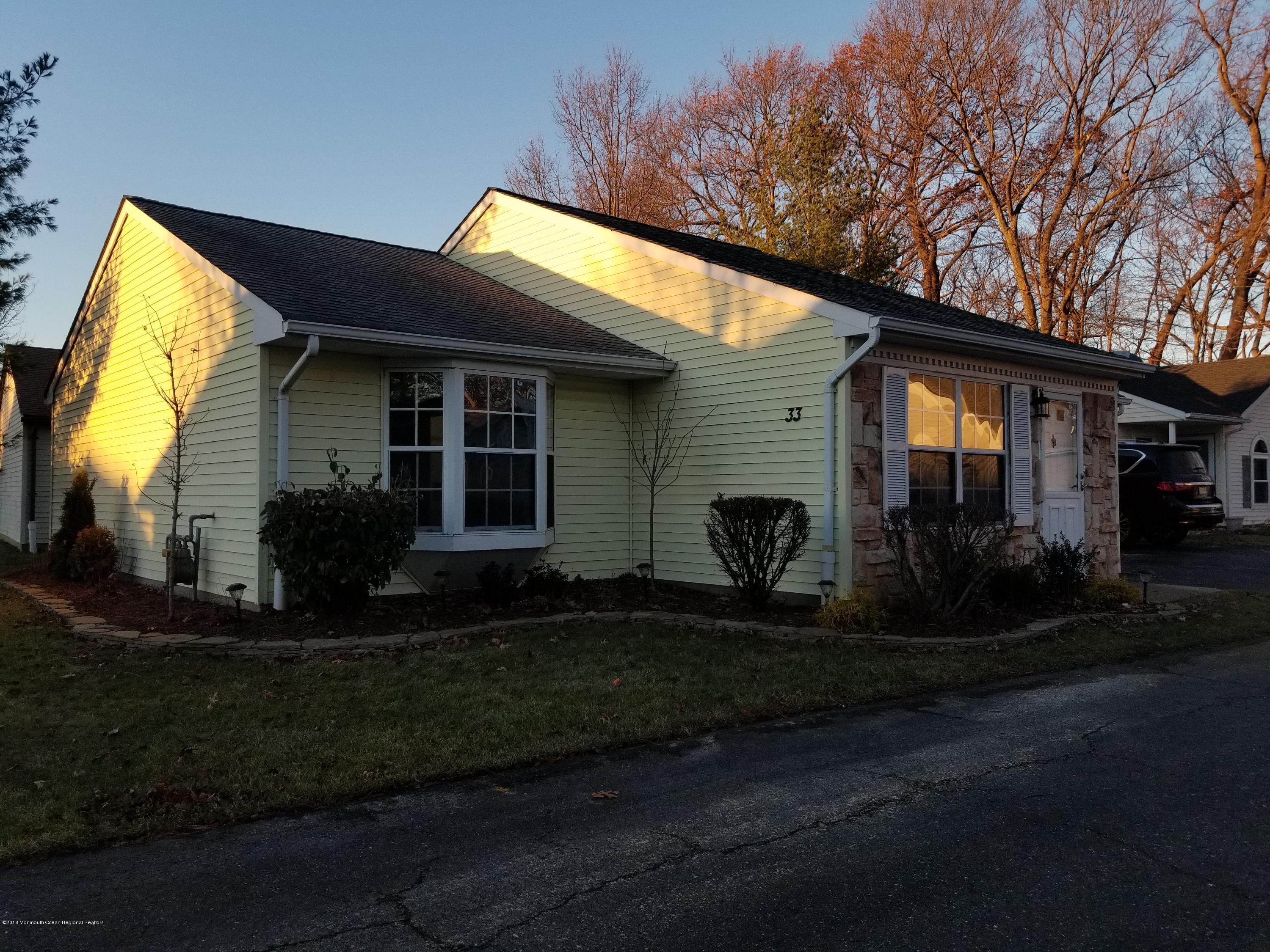 33 Ivy Ridge Close, Unit 1000 Freehold, NJ 07728 - Photo 1 of 31 a view of a house with backyard and garden