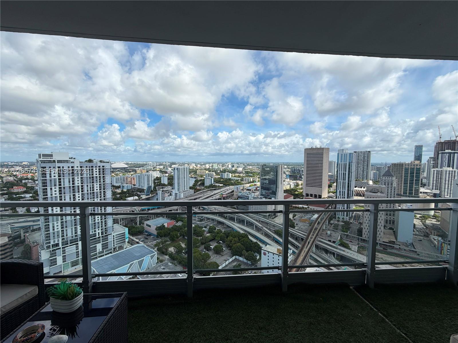 90 Southwest 3rd Street, Unit 4006 Miami, FL 33130 - Photo 18 of 19 a view of a balcony with chairs