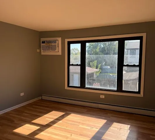 a view of a room that has a bed in it