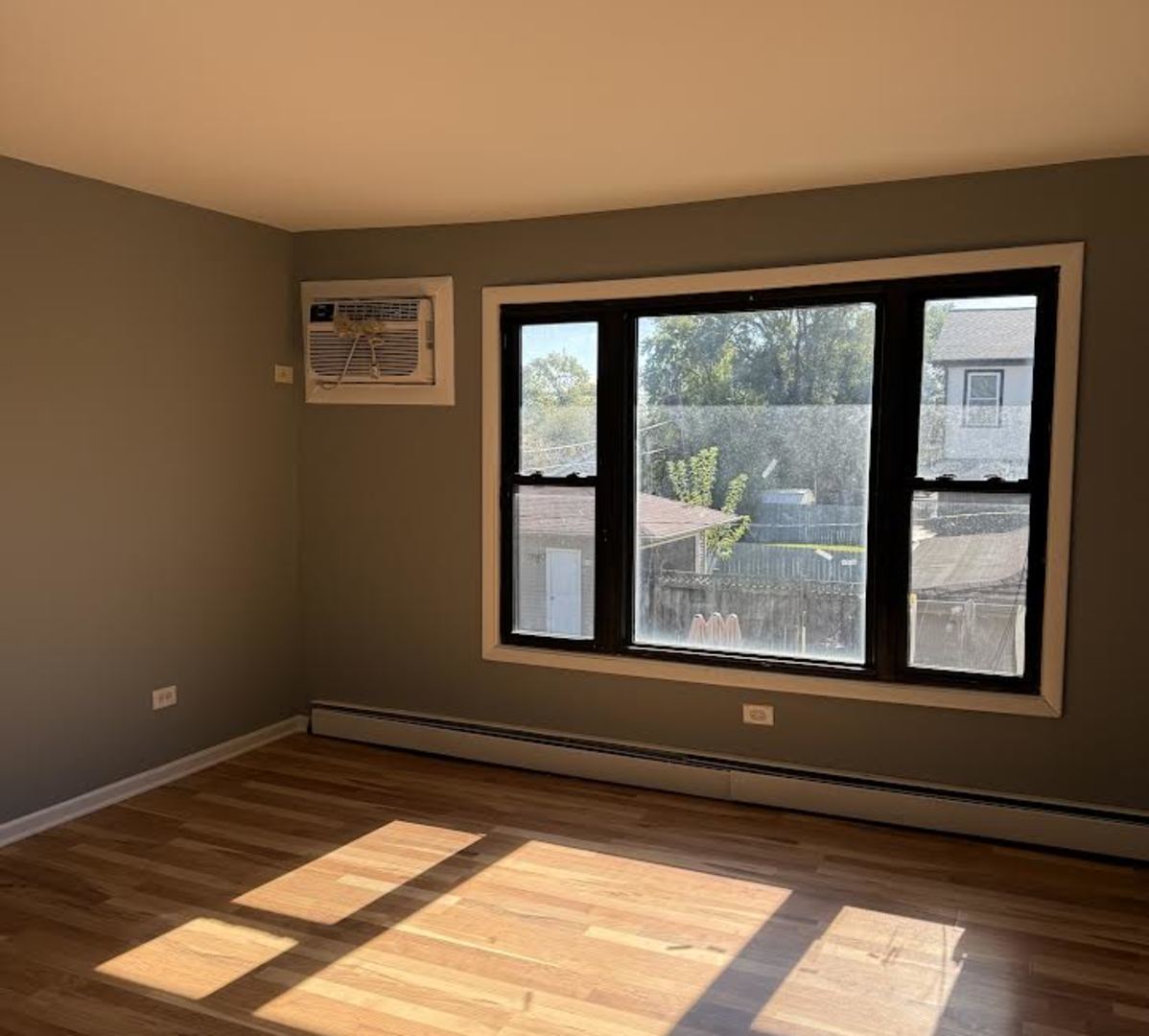 7719 South Roberts Road Bridgeview, IL 60455 - Photo 4 of 7 a view of a room that has a bed in it