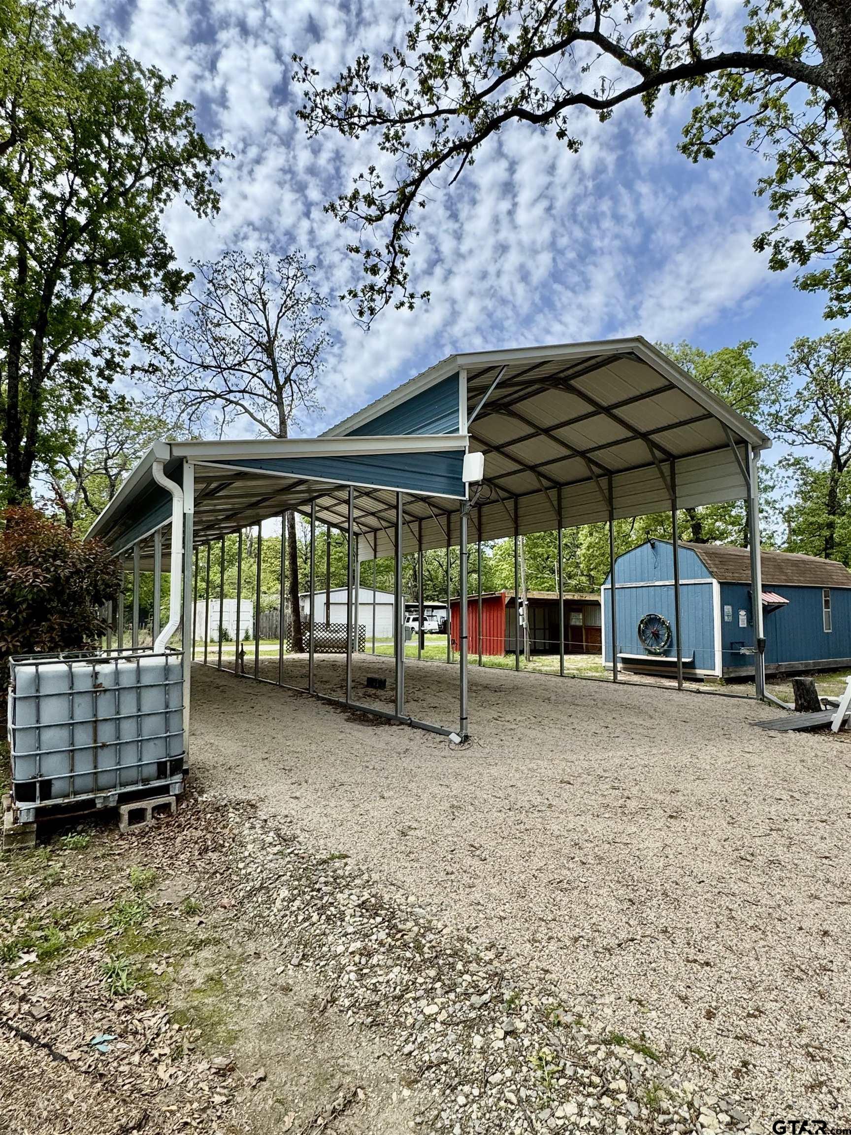107 Private Road 7713 Emory, TX 75440 - Photo 14 of 22 a view of a house with a porch and furniture