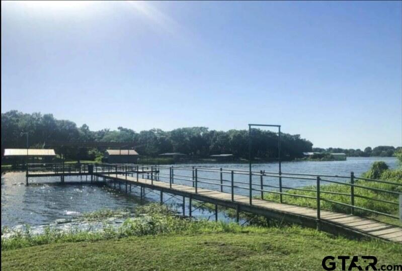 107 Private Road 7713 Emory, TX 75440 - Photo 19 of 22 a view of a lake with a garden