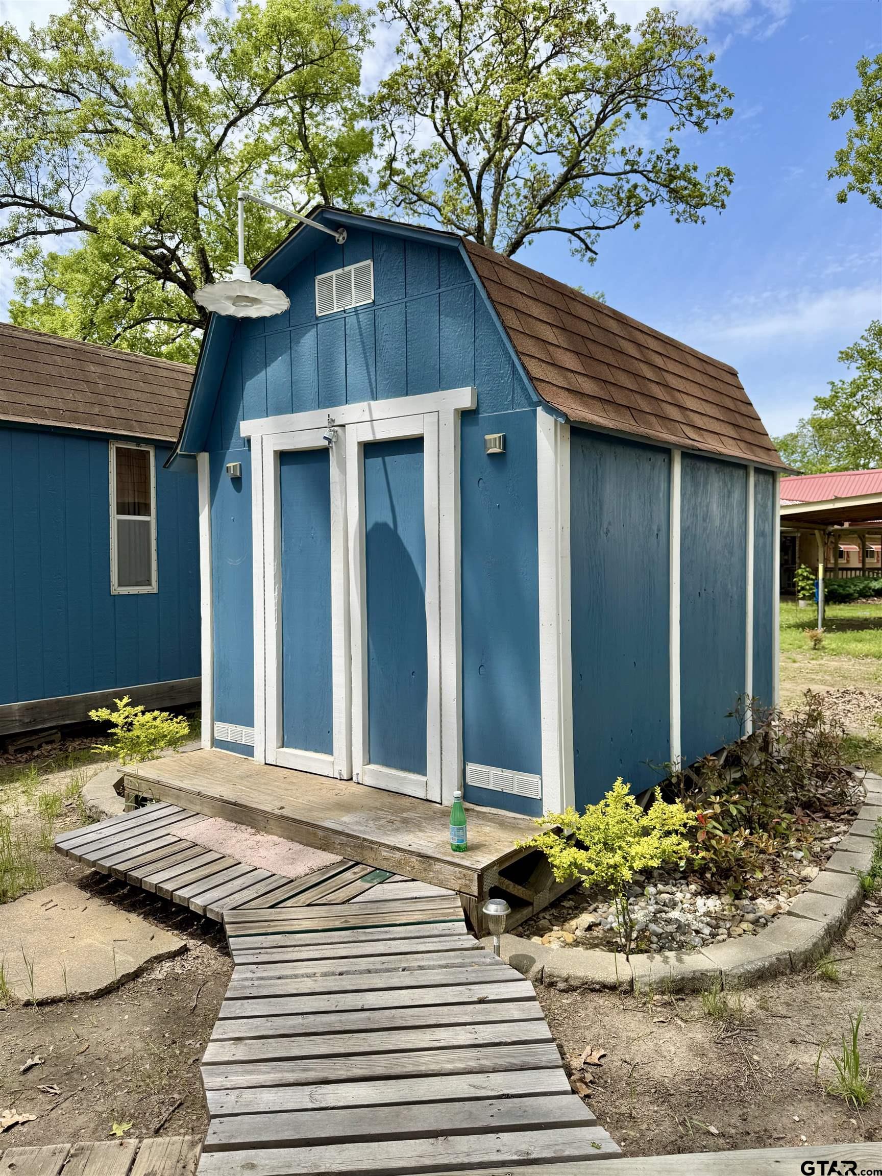 107 Private Road 7713 Emory, TX 75440 - Photo 2 of 22 a view of a house with a patio