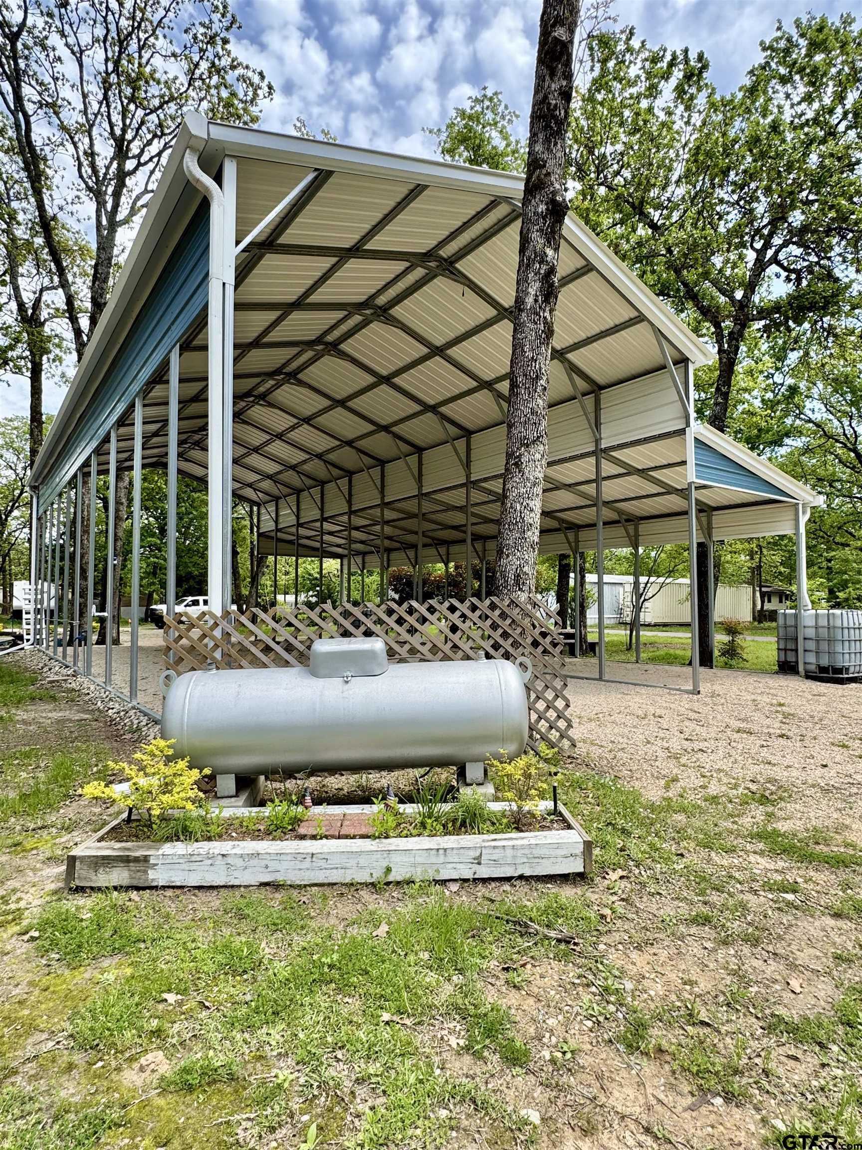 107 Private Road 7713 Emory, TX 75440 - Photo 8 of 22 a view of a house with backyard and sitting area