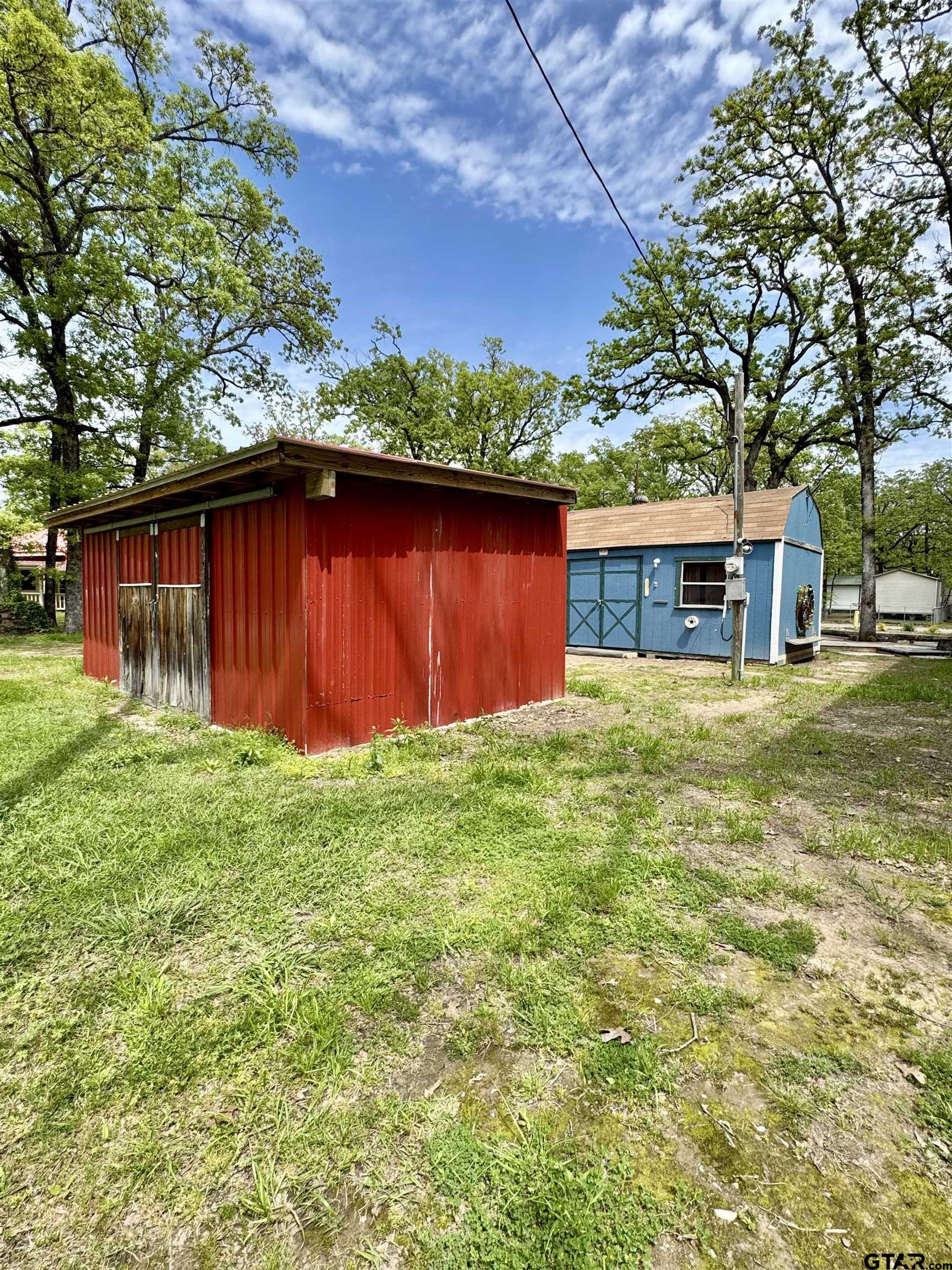 107 Private Road 7713 Emory, TX 75440 - Photo 10 of 22 a view of a house with a yard